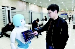 太原火车站智能机器人为旅客服务 - 太原新闻网